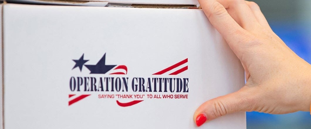 Hand Holding Operation Gratitude Shipping Box