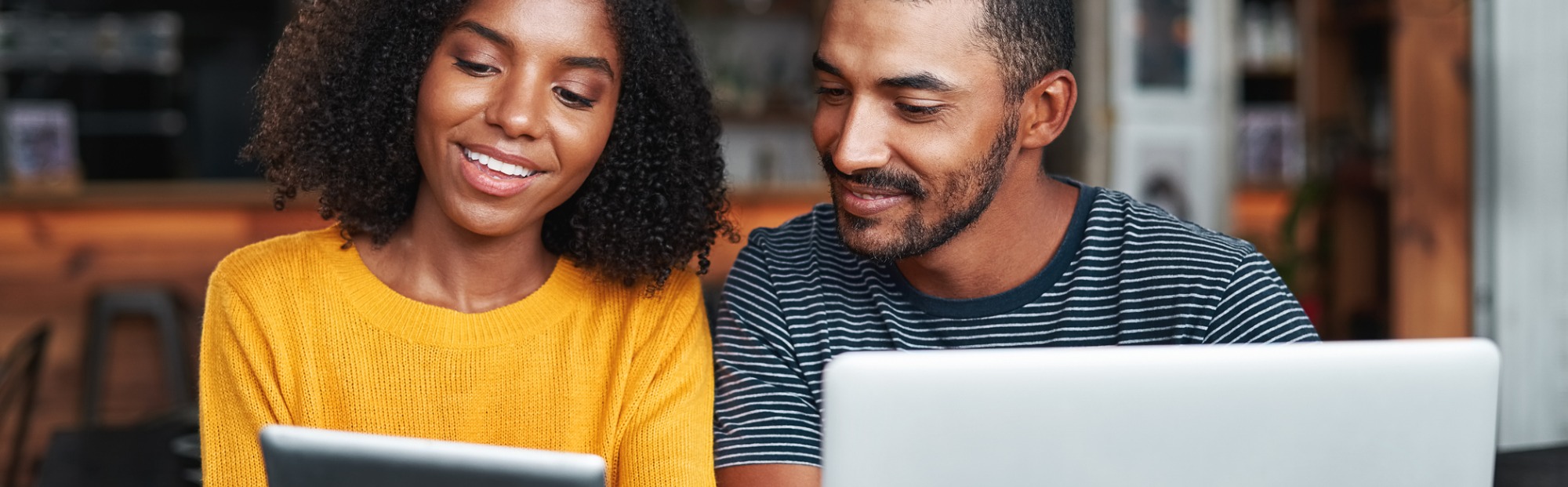 Couple looking at their mobile devices