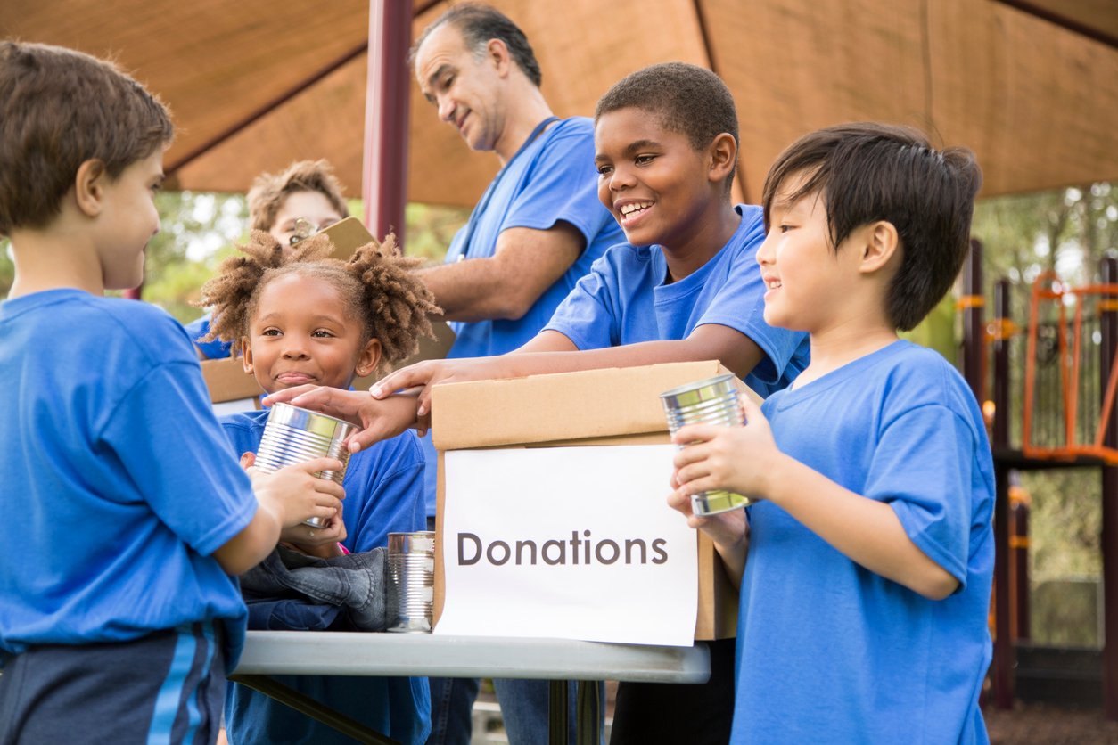 Group of Children Volunteering to Collect Donations